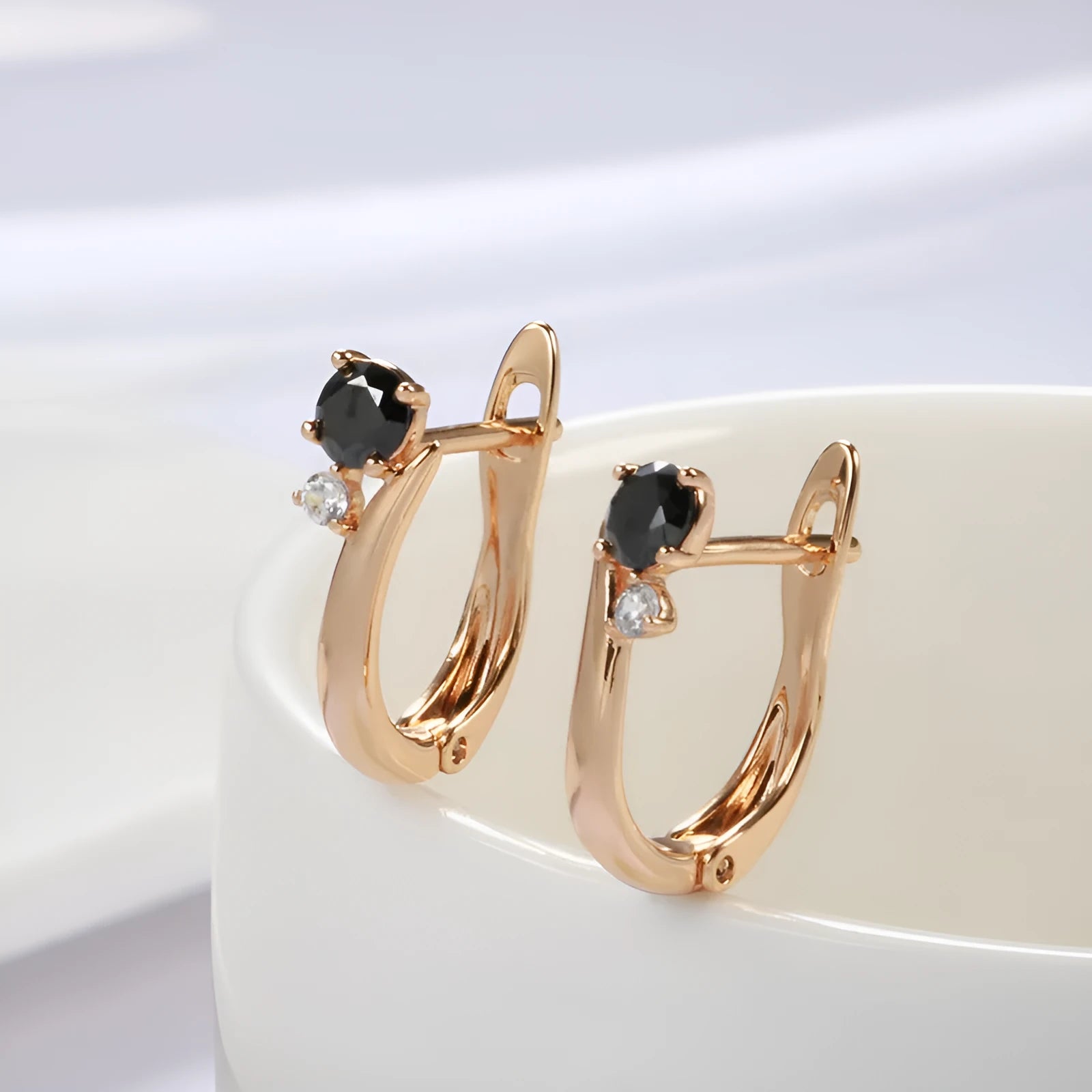 Gold-plated drop earrings with black agate stones in retro geometric design