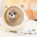 Cute dog-themed USB desktop electric fan in a choice of six colours on a wooden desk.