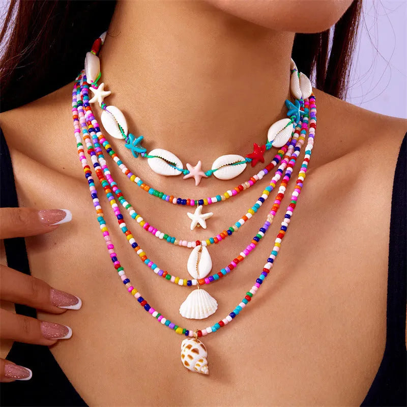 Five-piece women's necklace set with starfish shell and conch bead designs on electroplated alloy