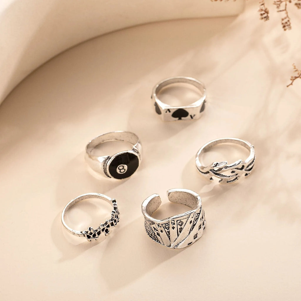 Black alloy adjustable ring with a raised retro spade card symbol design.