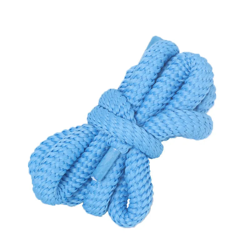 Oval round shoelace in multiple colours showing 1.0cm width, next to a sneaker.