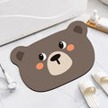 Cartoon animal design diatom oil bathroom mat in alien shape on bathroom floor.