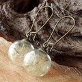 Clear glass ball earrings with crystal dandelion seed design on French hook
