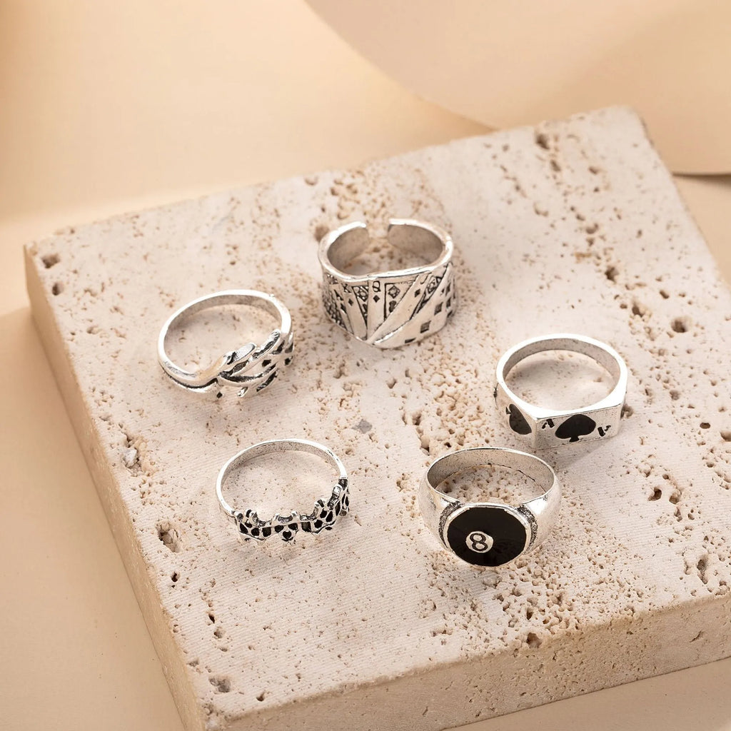 Black alloy adjustable ring with a raised retro spade card symbol design.