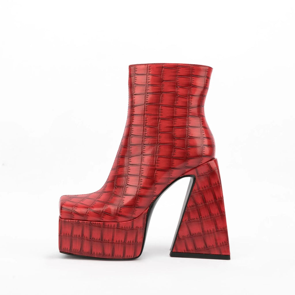 Women's solid colour ankle boot with a high heel, shown in an available colour like red or black.