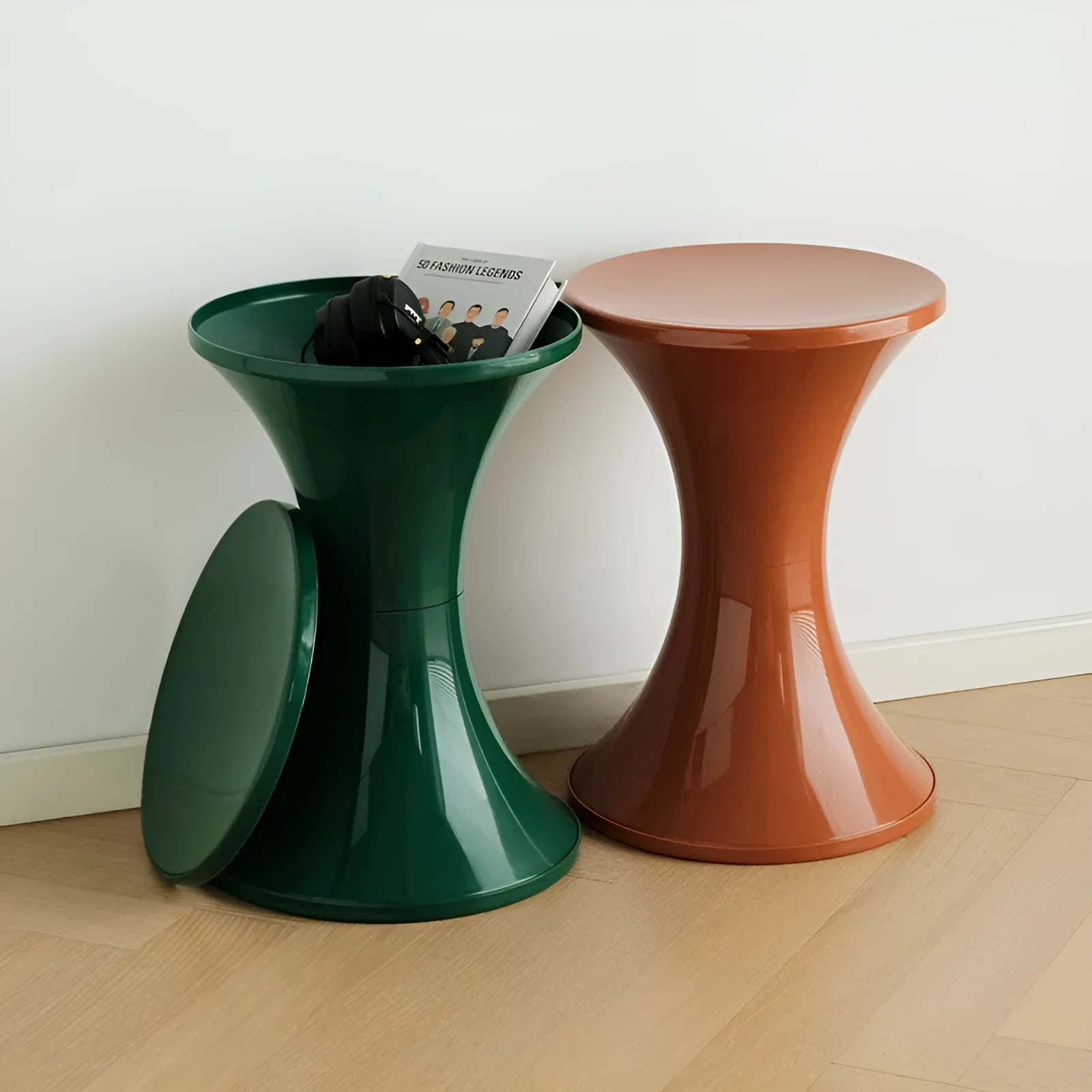 Plastic hourglass style shoe changing stool in green, shown in a home setting.