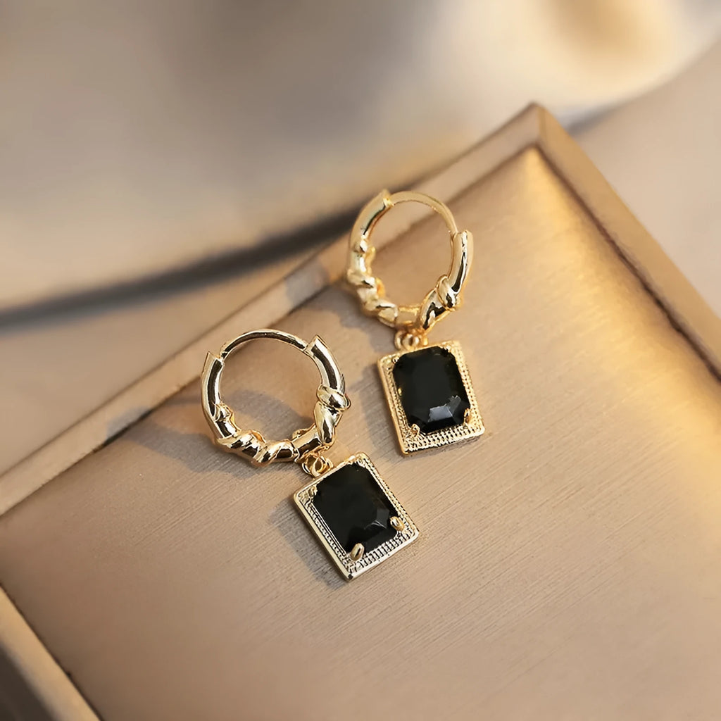 Geometric quadrilateral copper earrings with black zirconia centrepiece in French Court Retro style for women.
