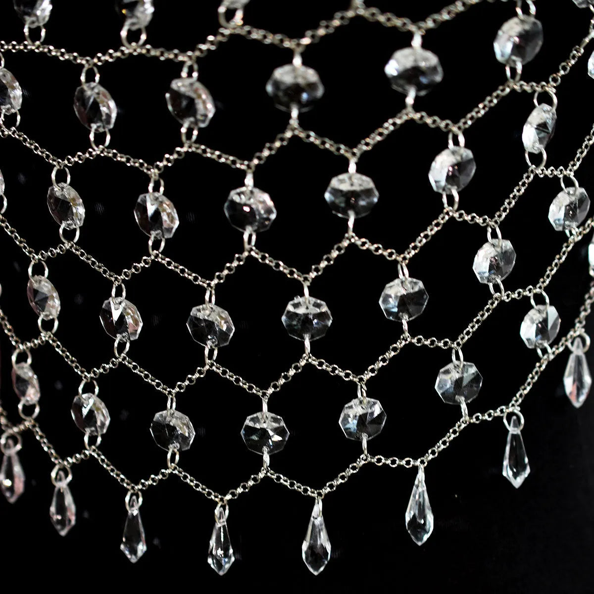 Hand-woven transparent acrylic crystal sequins body chain chest necklace in round shape on display