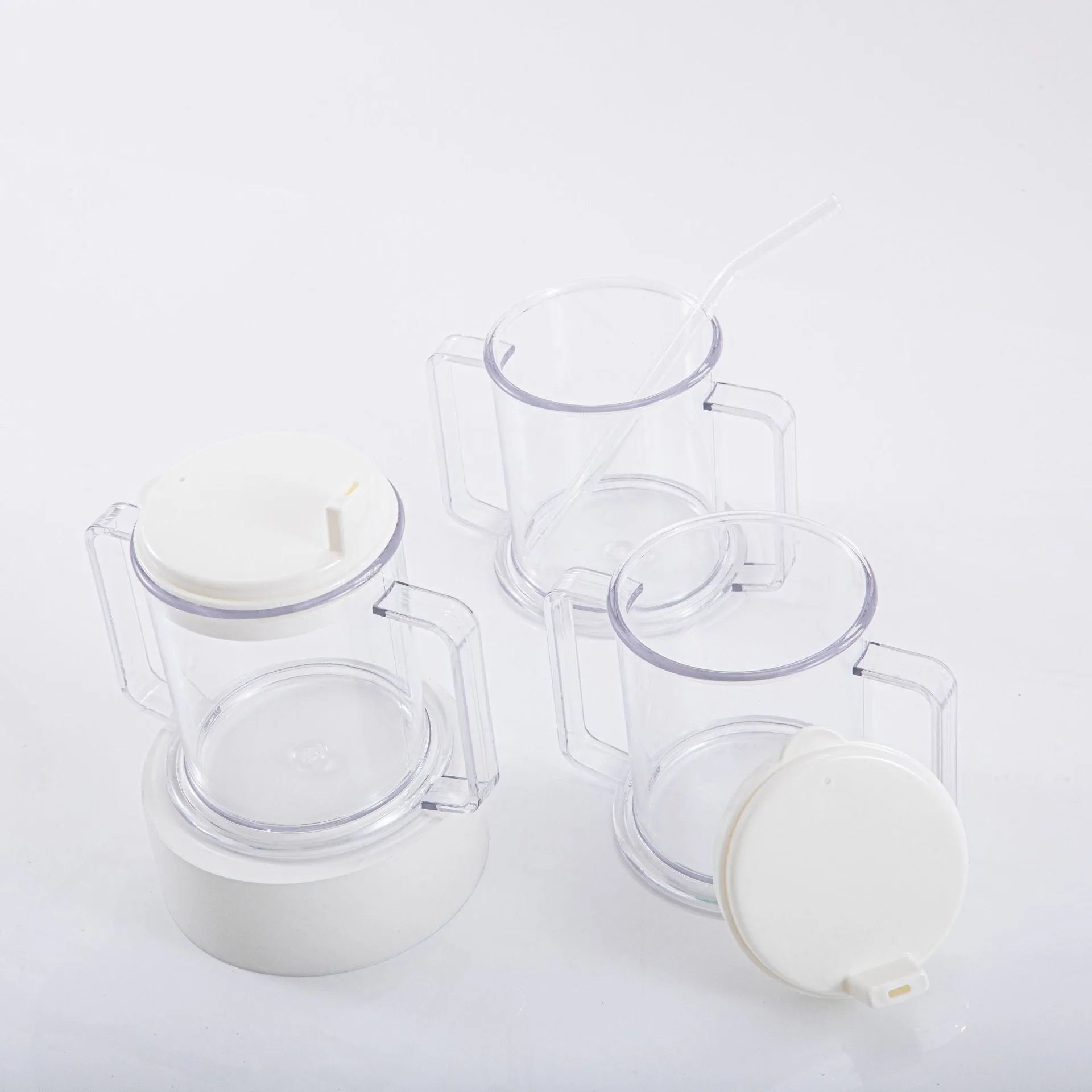 Transparent spill-proof drinking cup with lid on white background