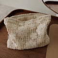 Handmade corduroy cosmetic bag with crocheted hollow flower embroidery