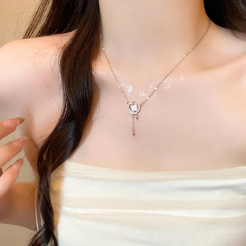 Gold or silver women's necklace with star moon pendant and sparking stones on a copper chain.