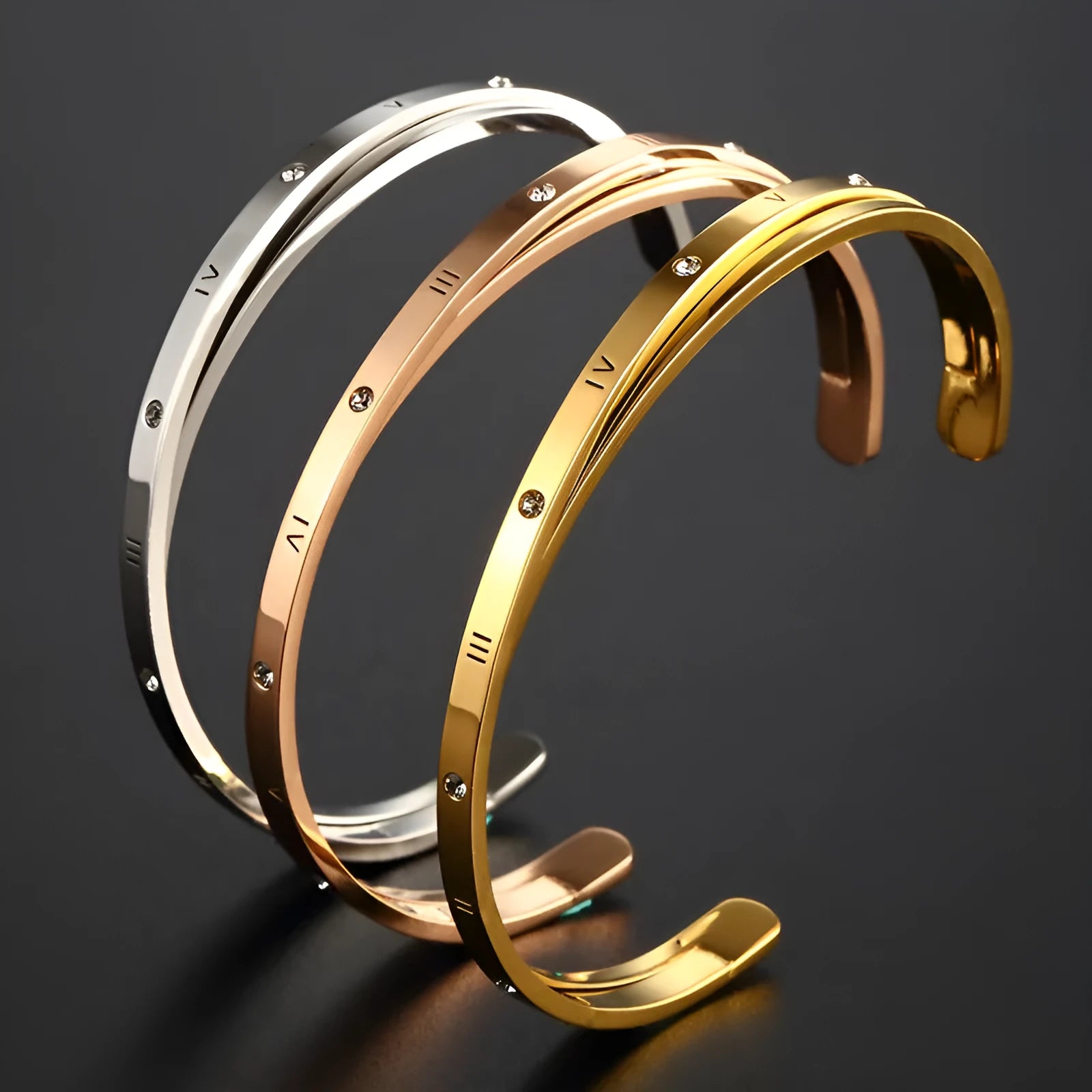 Open-ended stainless steel bracelet for women with inlaid zircon, shown in gold colour finish.