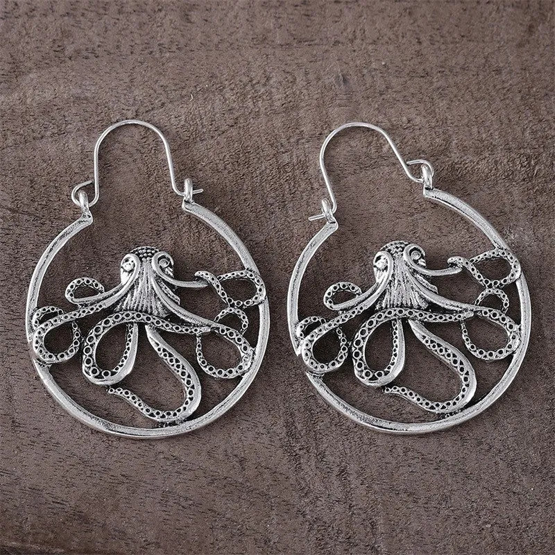 A pair of vintage-style octopus-shaped earrings in an antique silver colour.