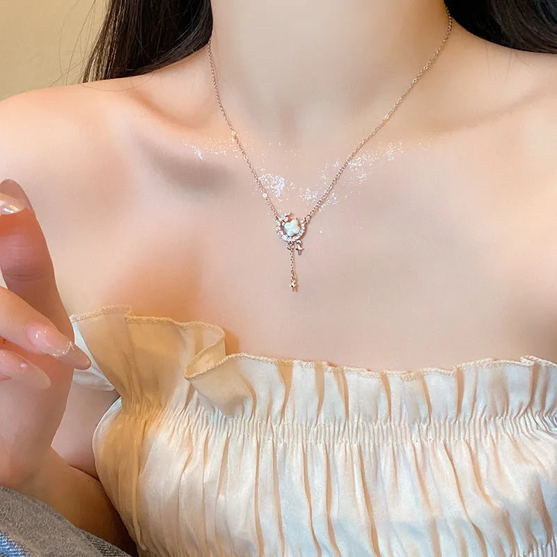 Gold or silver women's necklace with star moon pendant and sparking stones on a copper chain.