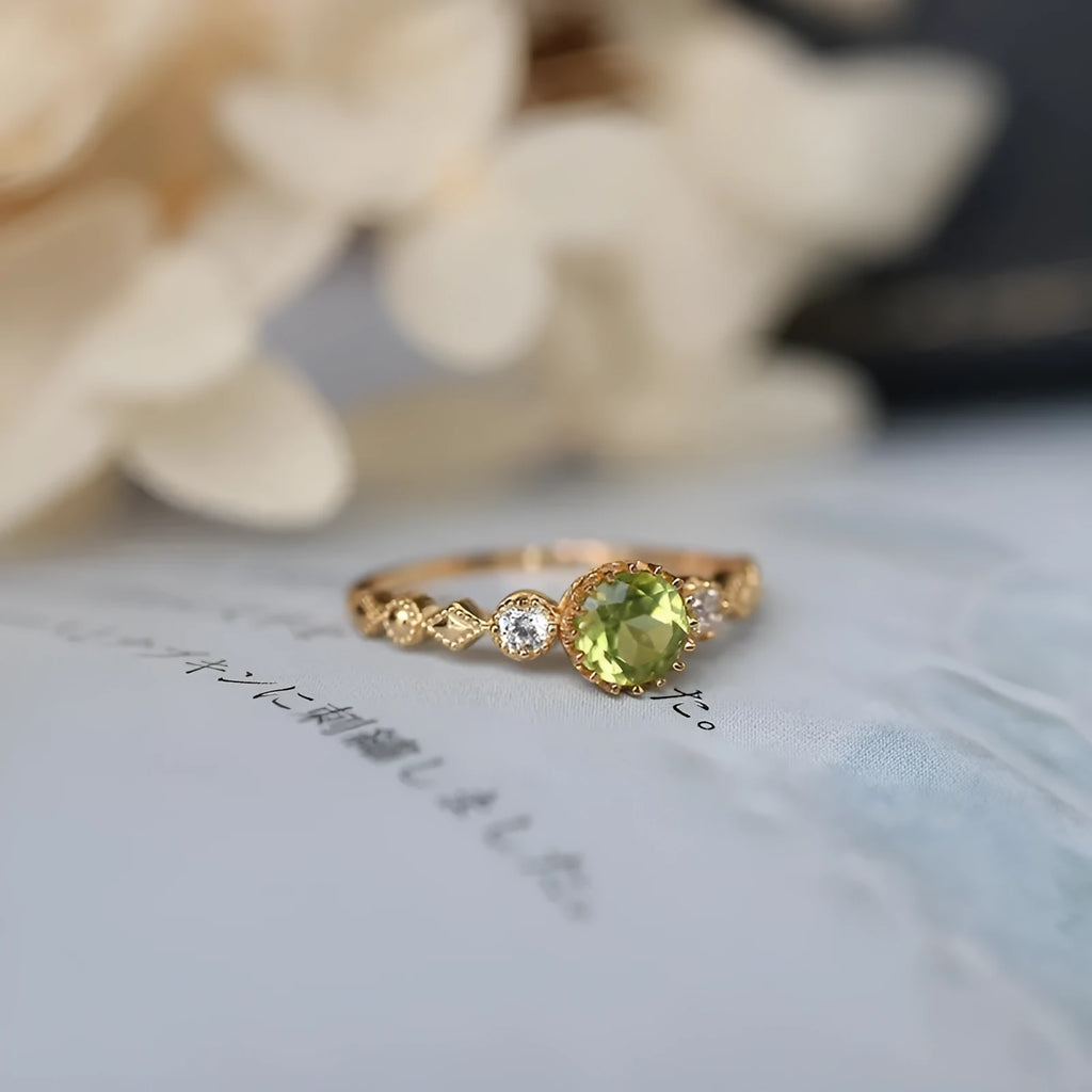 Japanese style copper ring with geometric quadrilateral shape and imitation peridot colour.
