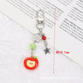 Fruit-themed mobile phone bag pendant keychain with resin apple and strawberry designs