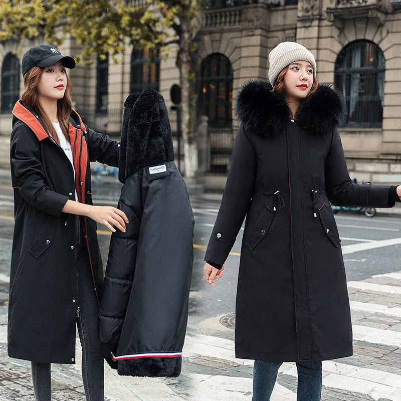 Women's long beige trench coat with fleece lining and a two-way zip front closure.