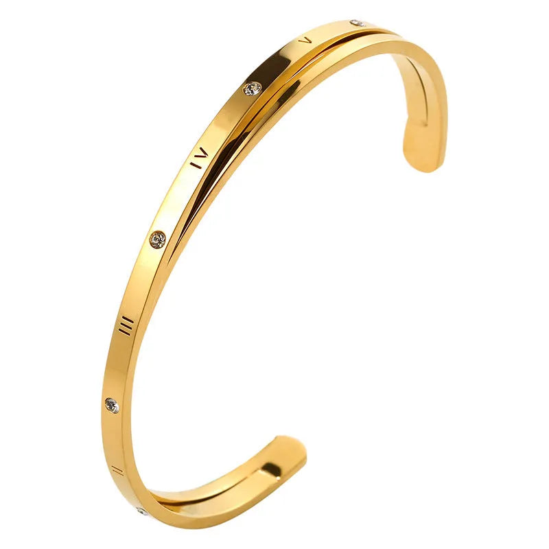 Open-ended stainless steel bracelet for women with inlaid zircon, shown in gold colour finish.