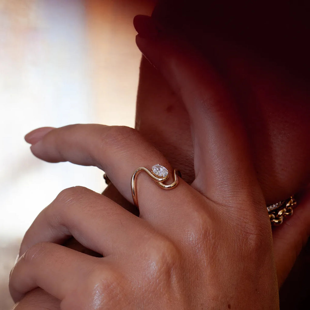 Geometric stainless steel zircon ring on a grey background showing European and American style.