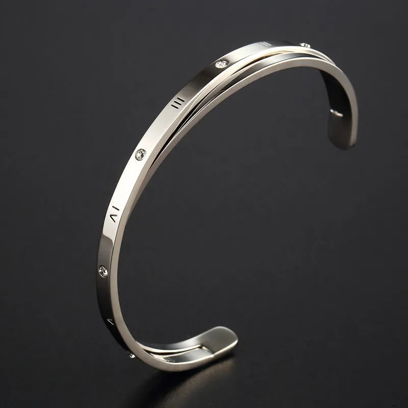 Open-ended stainless steel bracelet for women with inlaid zircon, shown in gold colour finish.