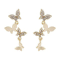 Copper butterfly earrings with four gold-colour charm drops for women