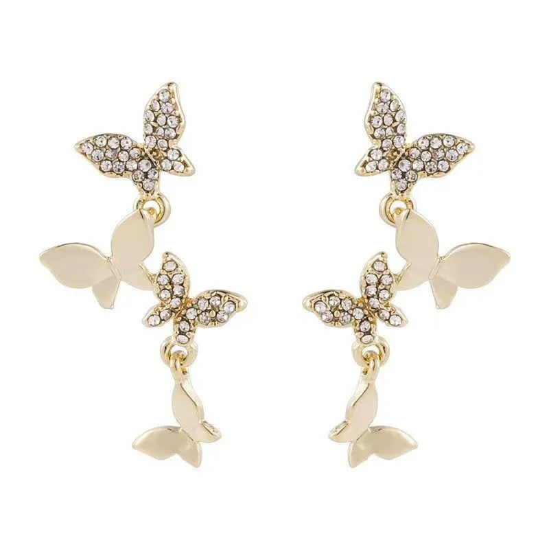 Copper butterfly earrings with four gold-colour charm drops for women