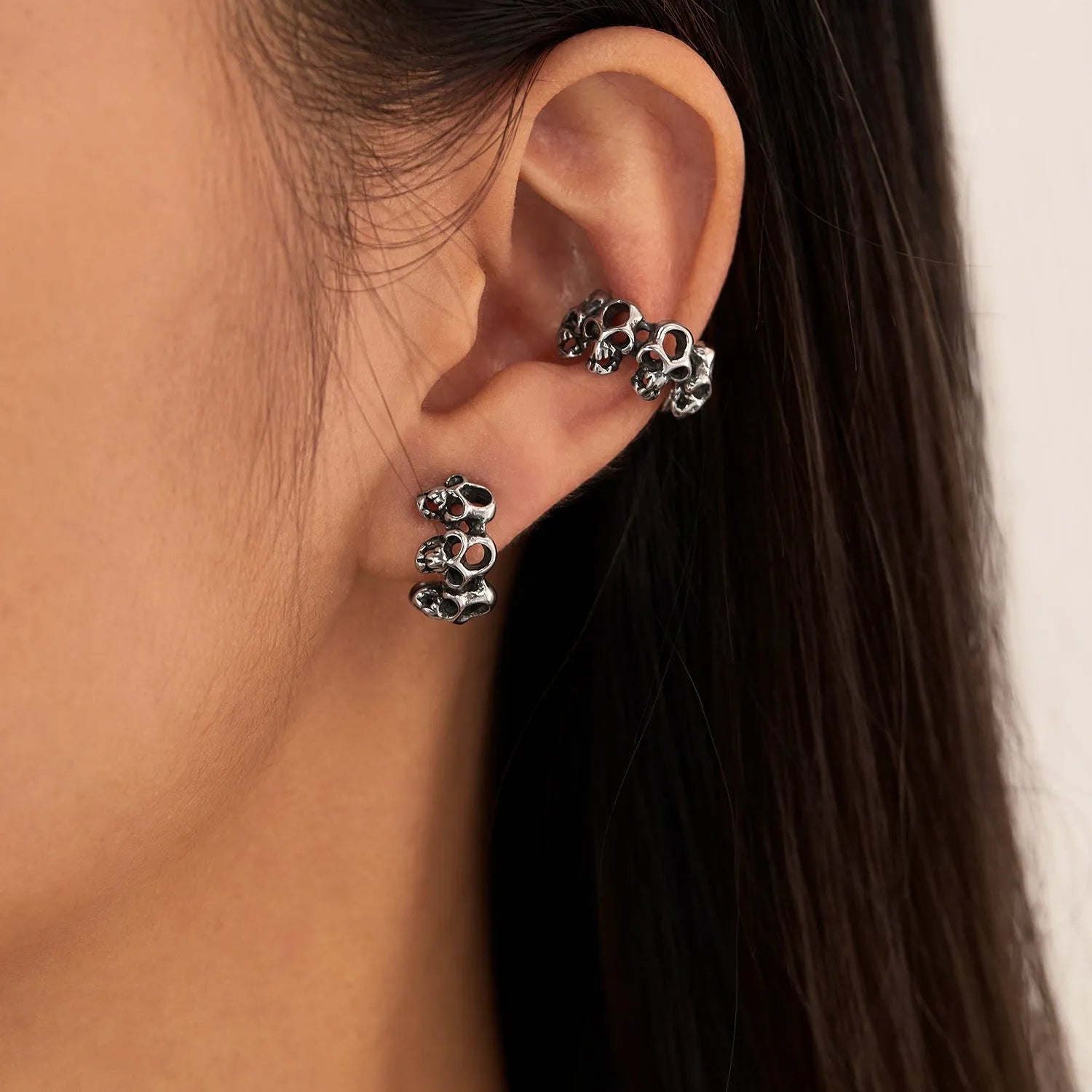 Stainless steel geometric skull ear clips with hollow design and electroplated finish