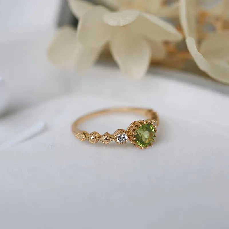 Japanese style copper ring with geometric quadrilateral shape and imitation peridot colour.