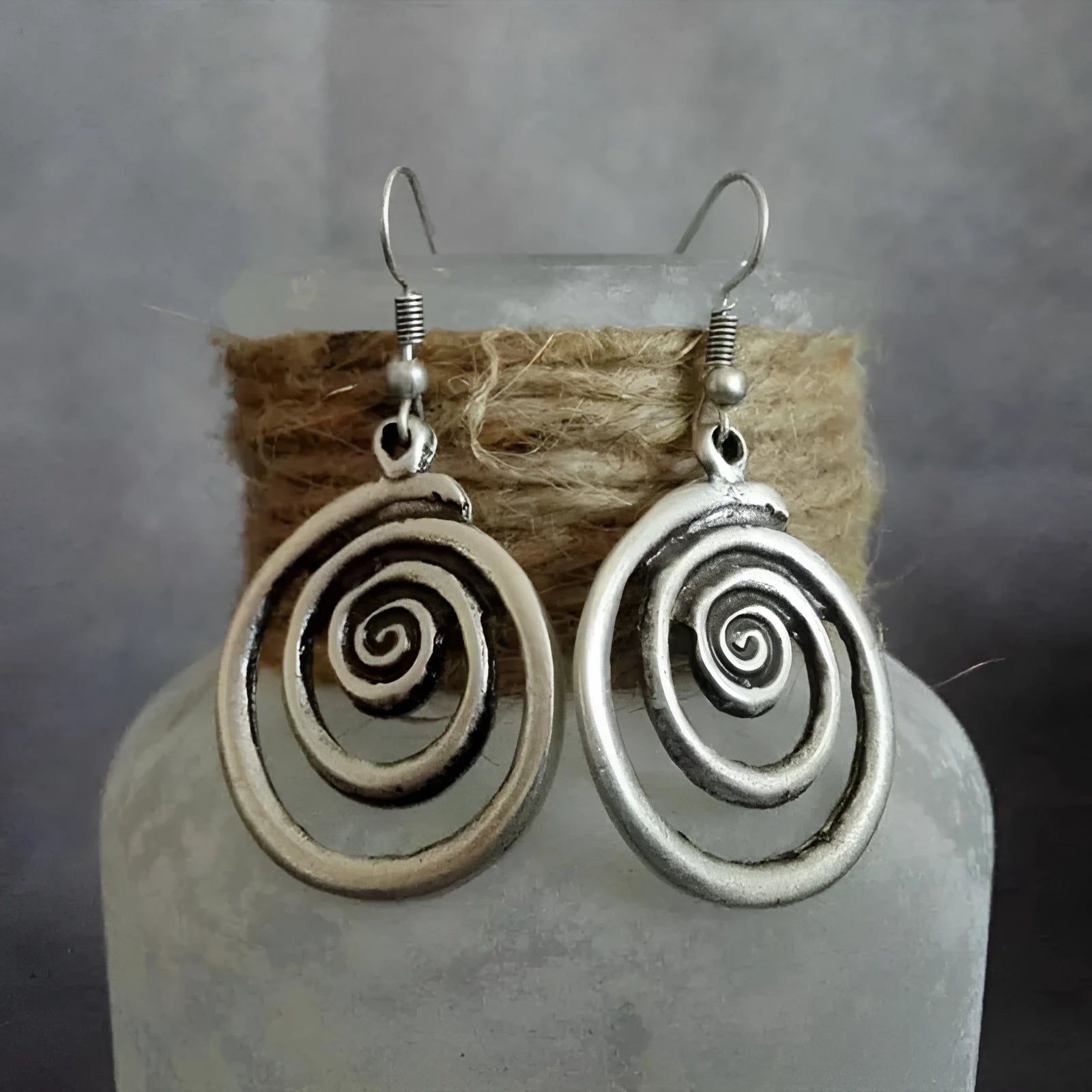 Retro geometric spiral distressed silver earrings showing 2.6cm width and 5cm length dimensions
