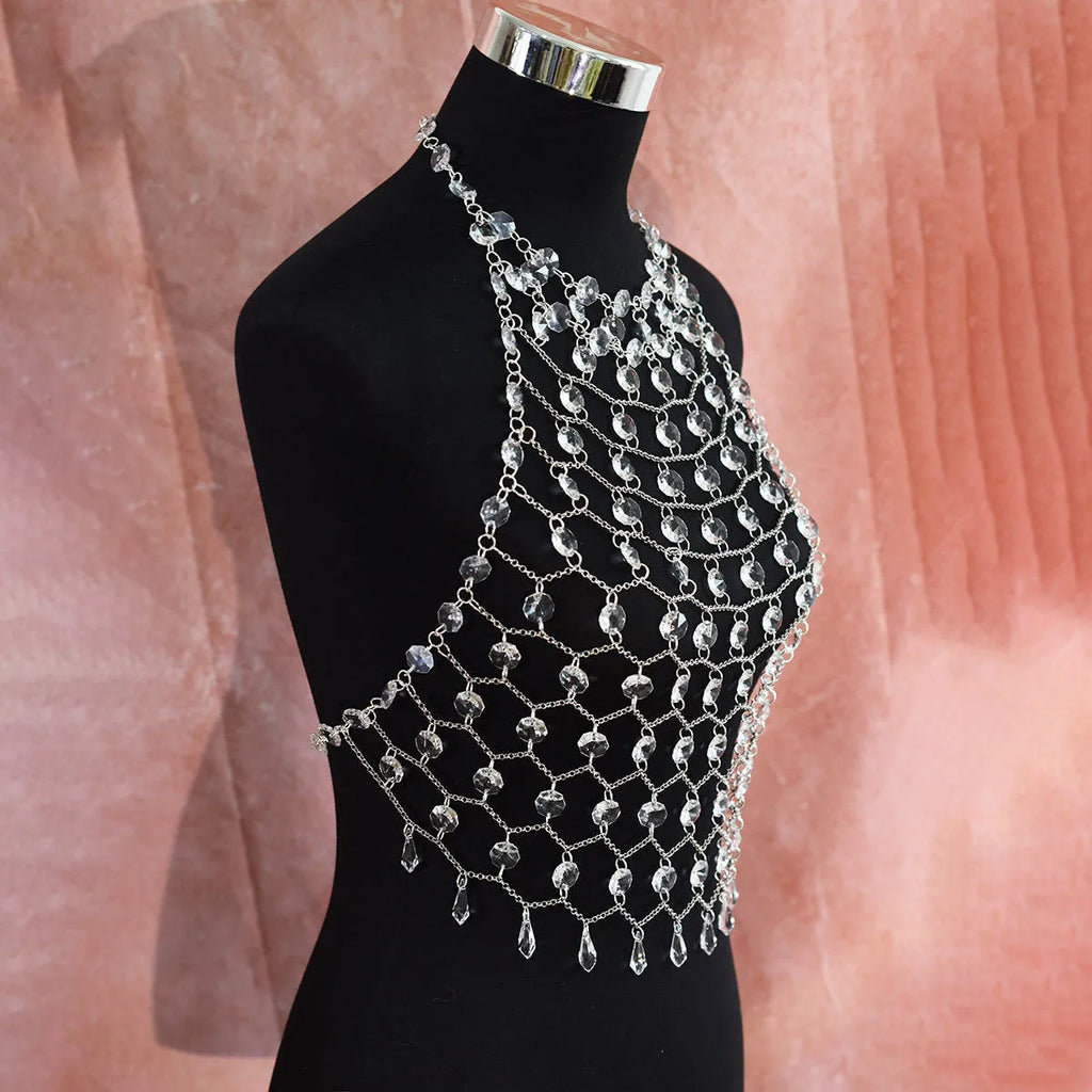 Hand-woven transparent acrylic crystal sequins body chain chest necklace in round shape on display
