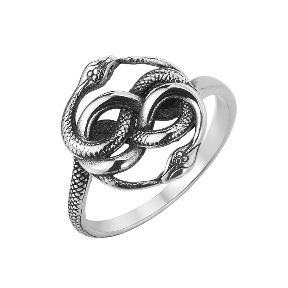 Close-up of a titanium steel double snake ring in a steel colour on a hand.