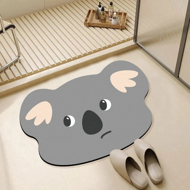 Cartoon animal design diatom oil bathroom mat in alien shape on bathroom floor.