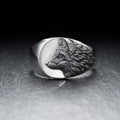 Men's geometric wolf head alloy statement ring in silver finish on a size guide showing options 6 to 12.