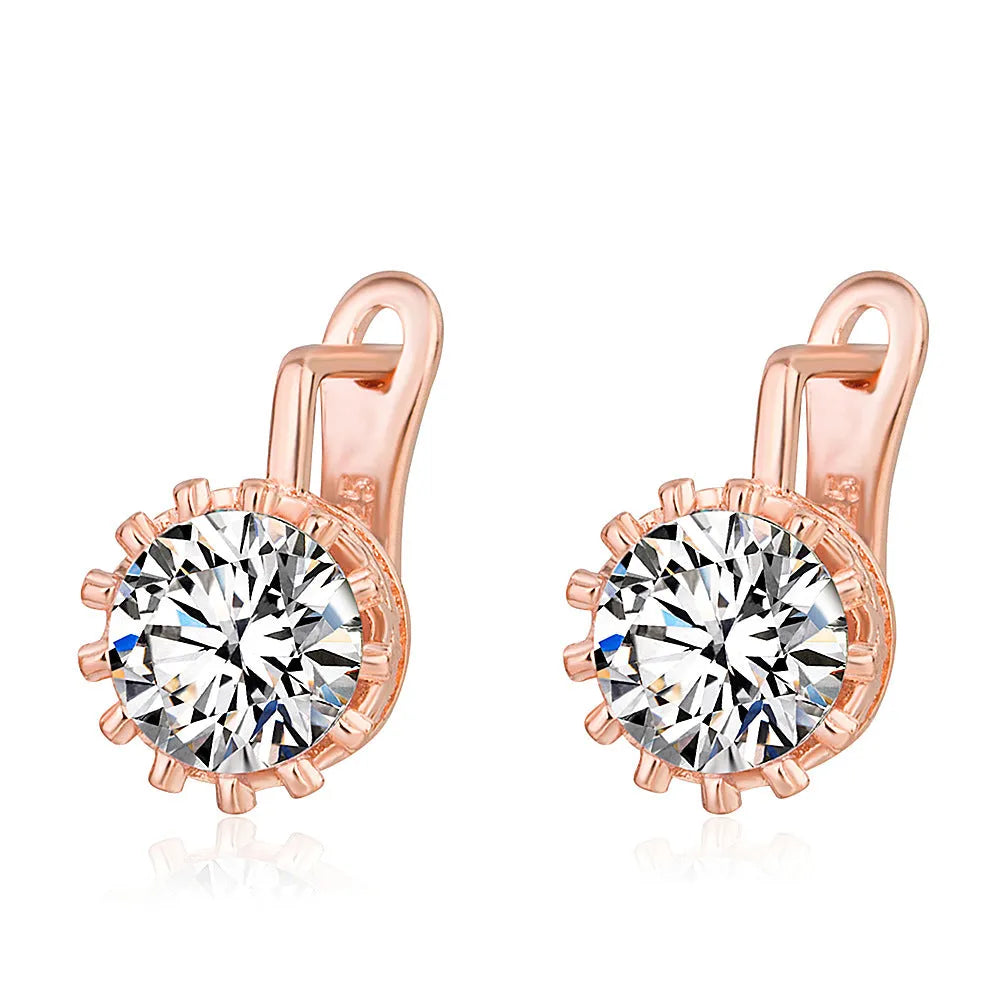 Korean retro crown-shaped clip-on earrings in rose gold and white gold colour finishes on a white background.