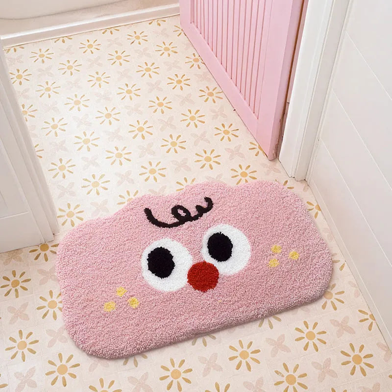 Cartoon anime Big Eye Clouds design bathroom mat in soft green colour on a bathroom floor.