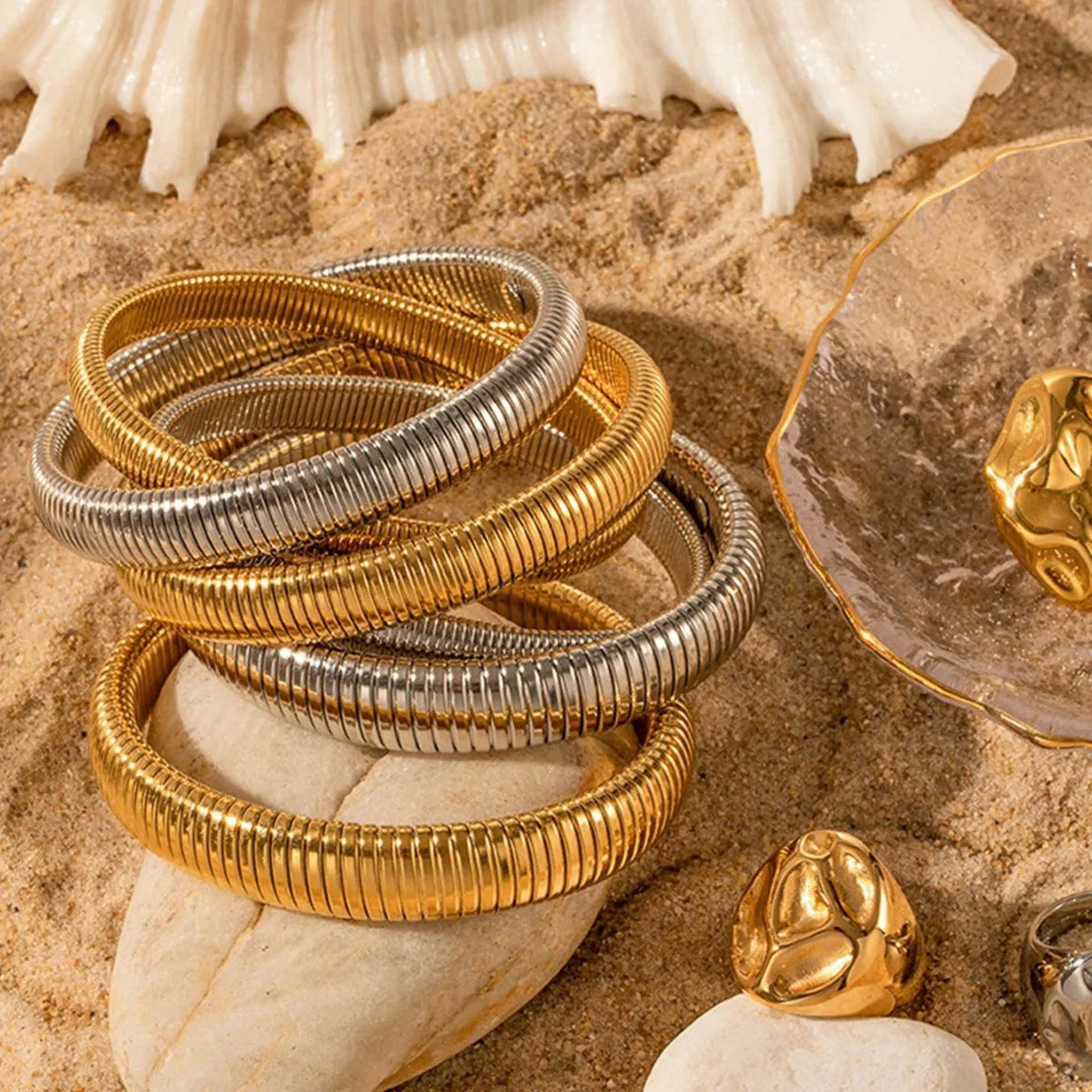 Women's titanium steel elastic bracelet with vertical stripe ring pattern in gold electroplated finish