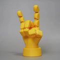 Yellow PLA movable joint hand ornament figurine on a white background.