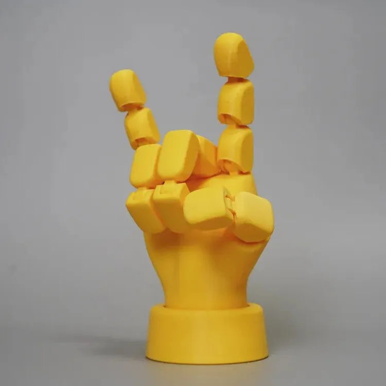 Yellow PLA movable joint hand ornament figurine on a white background.