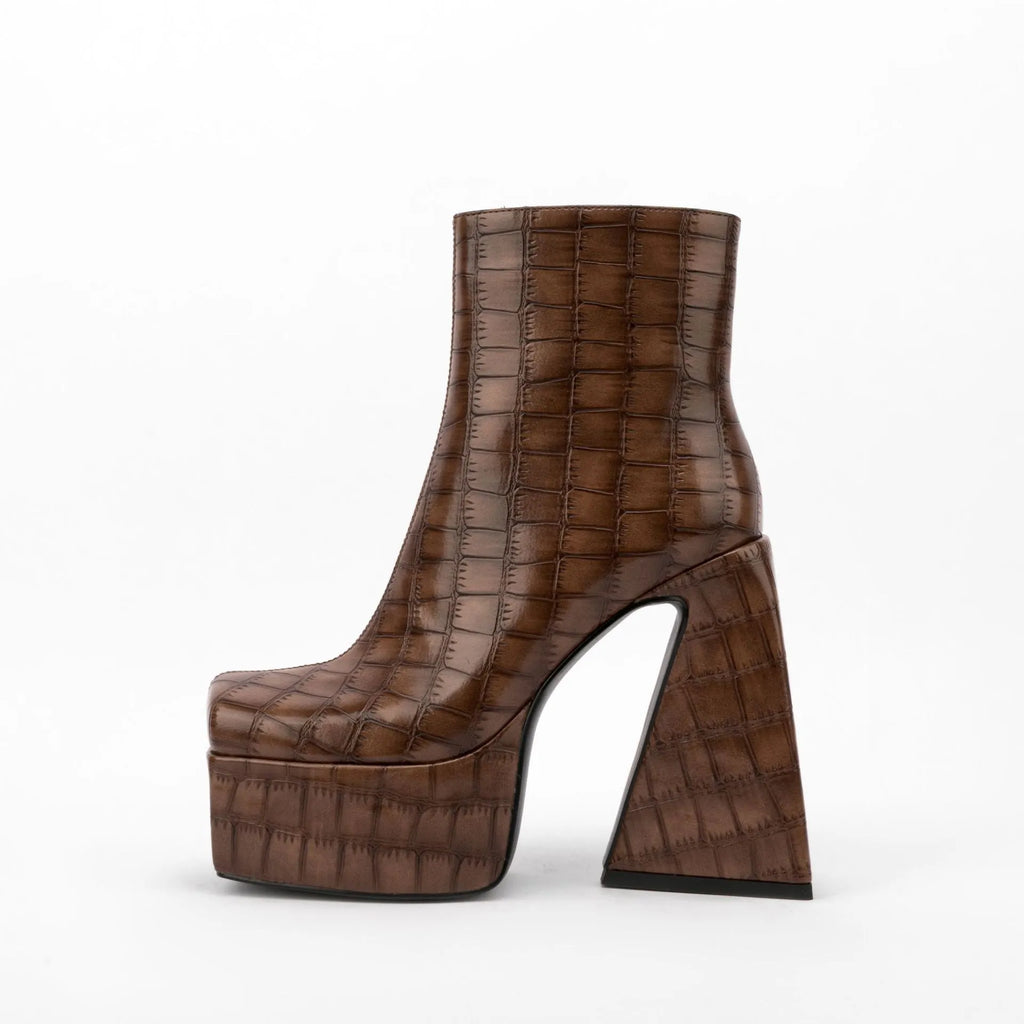 Women's solid colour ankle boot with a high heel, shown in an available colour like red or black.