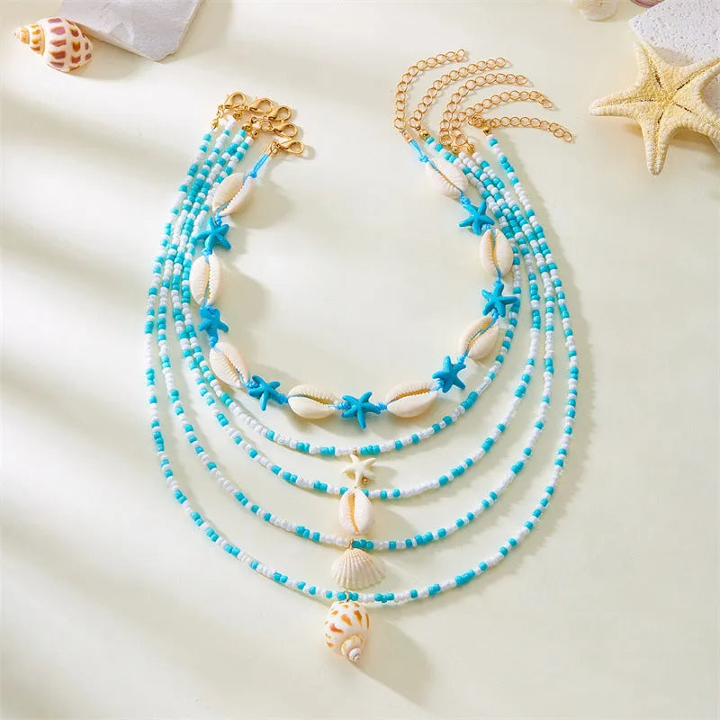 Five-piece women's necklace set with starfish shell and conch bead designs on electroplated alloy
