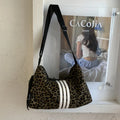 Leopard print sports messenger shoulder bag with stitching details