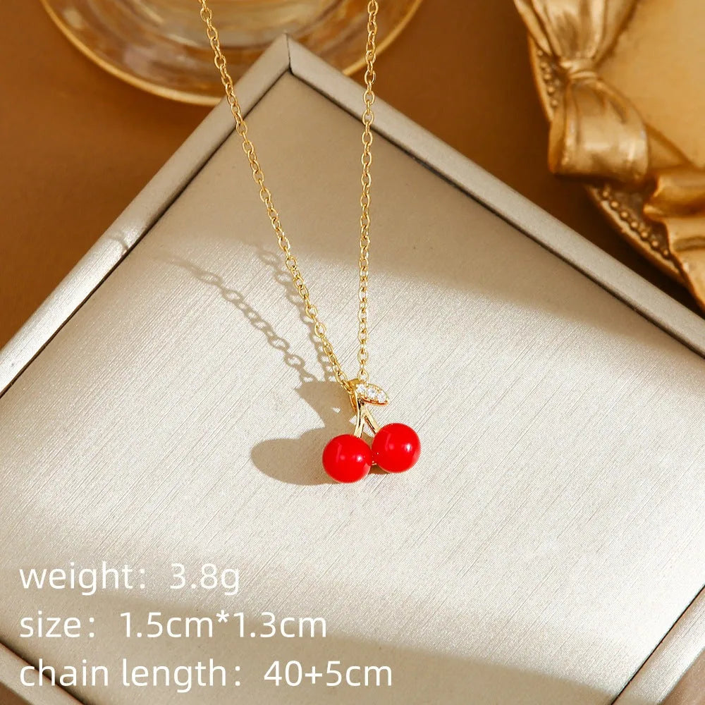 Titanium steel necklace with O-ring chain and delicate indie cherry pendant in golden finish