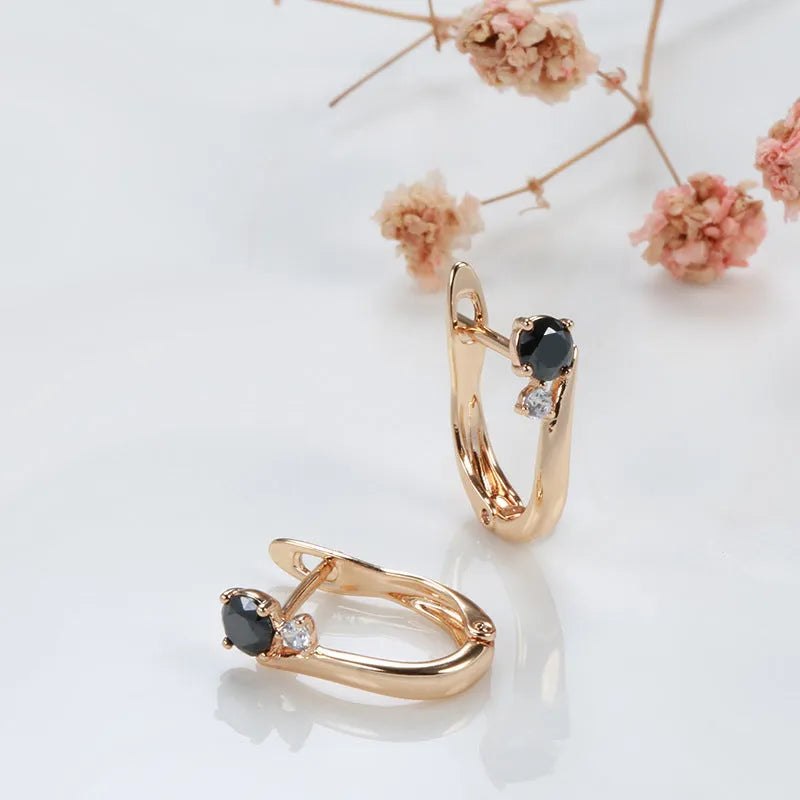 Gold-plated drop earrings with black agate stones in retro geometric design