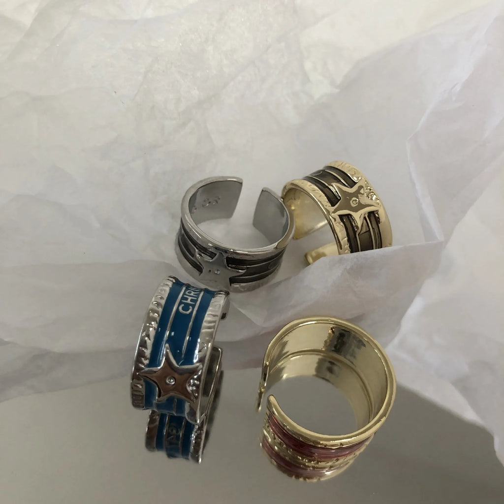 Adjustable geometric women's ring with a retro distressed XINGX drop oil design in copper.