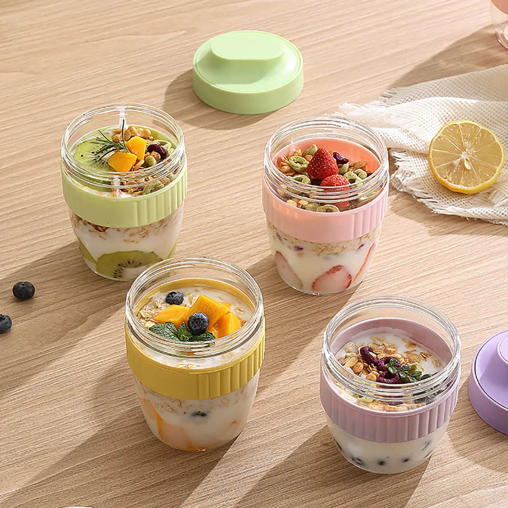 Green plastic salad cup with integrated spoon in lid, shown with leak-proof seal.