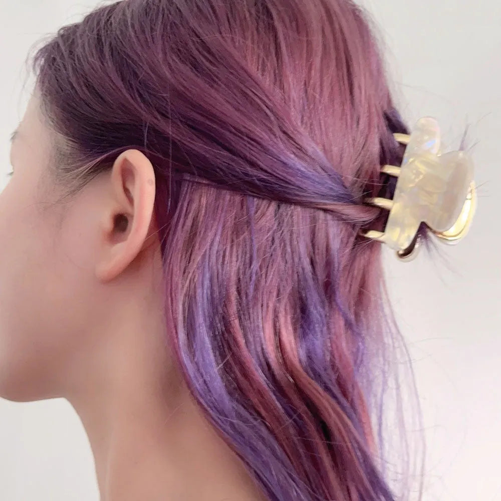 Women's retro acetate hair barrette with metal grip in leopard print pattern