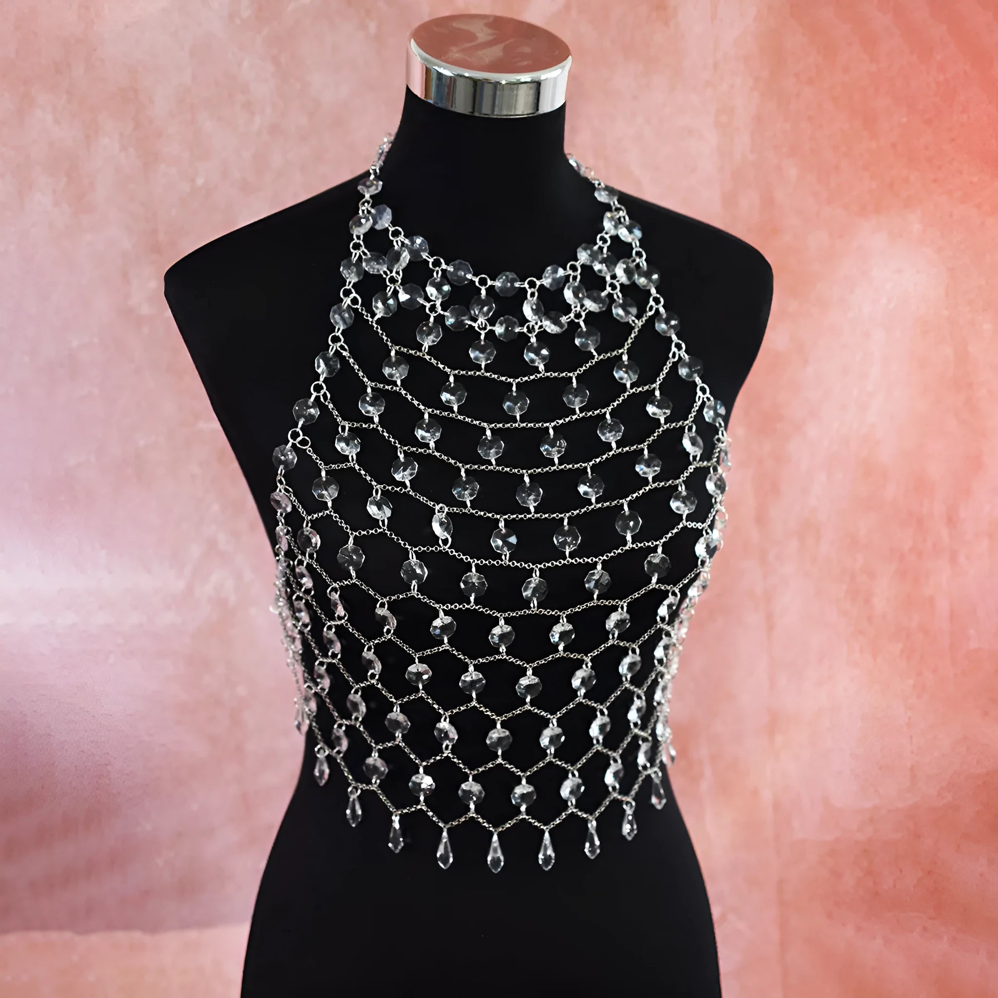 Hand-woven transparent acrylic crystal sequins body chain chest necklace in round shape on display