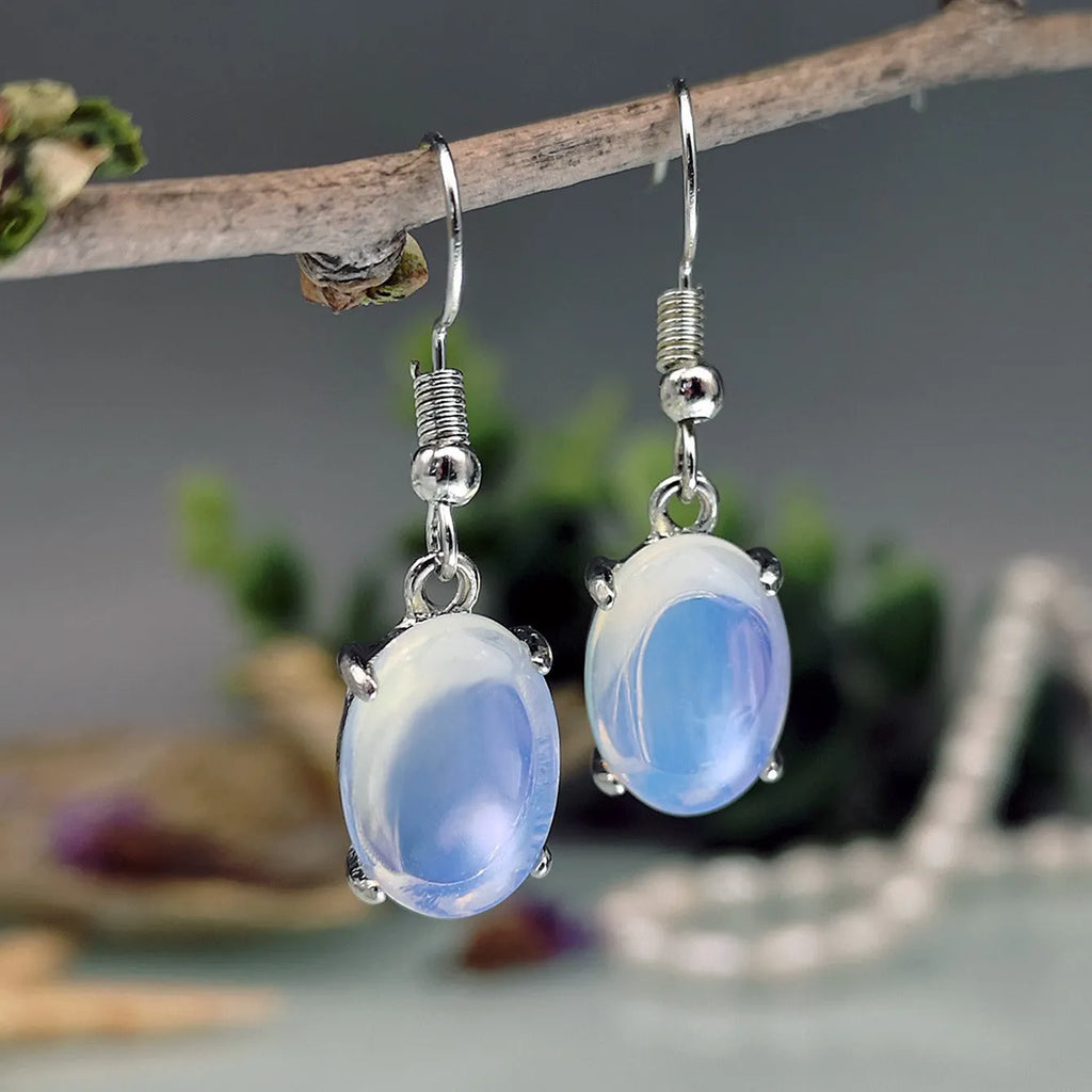 Moonlight White opal-coloured drop earrings with an ellipse design on a retro-inspired alloy setting.