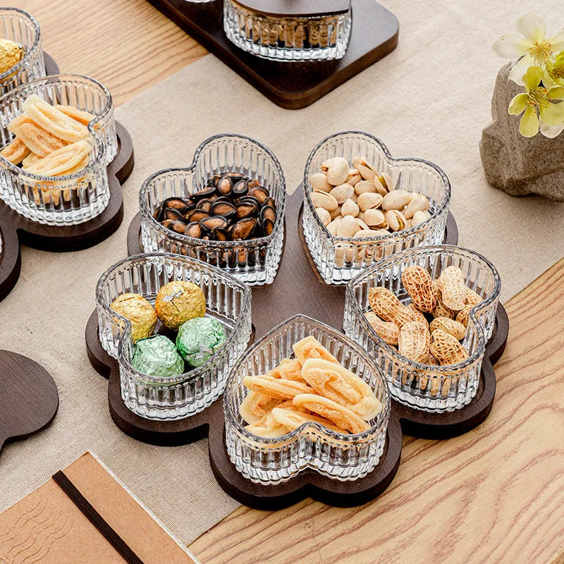 Glass fruit platter with transparent heart-shaped lids in compartmentalised serving tray