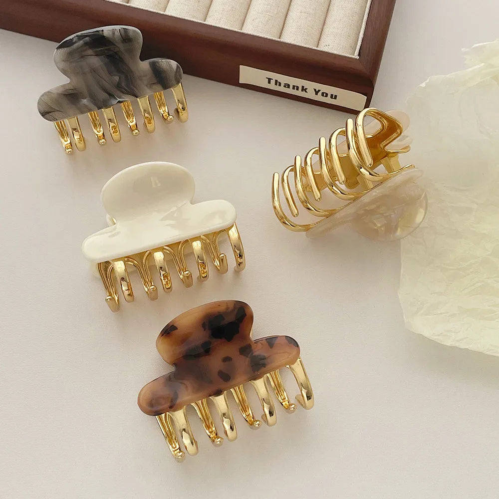 Women's retro acetate hair barrette with metal grip in leopard print pattern